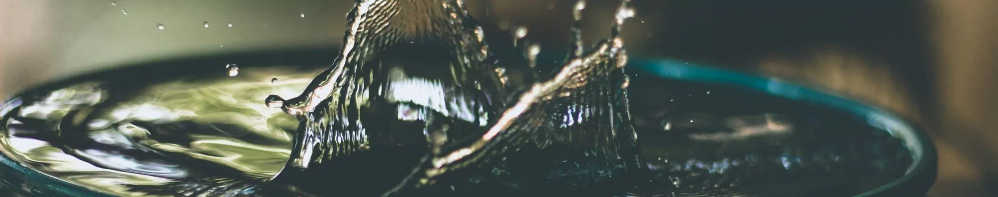Water treatment tablet splashing in cup