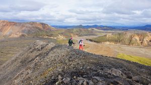 Hikers on rocky landscape