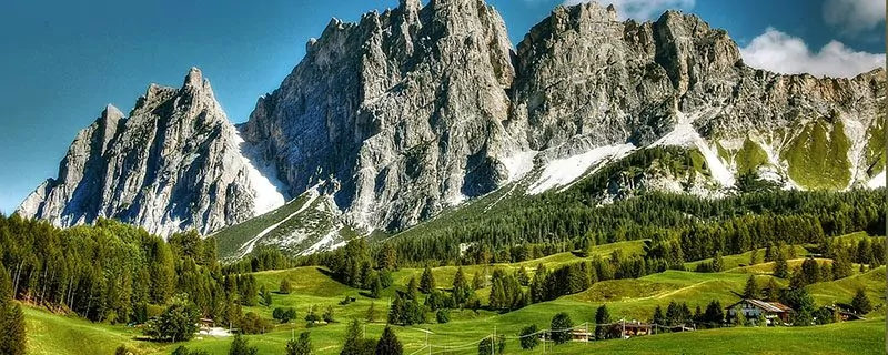 Lush green land with stone mountains