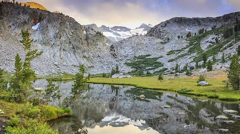An unamed lake and meadow campsite on the John Muir Trail in Yosemite National Park, just before Donahue Pass.
