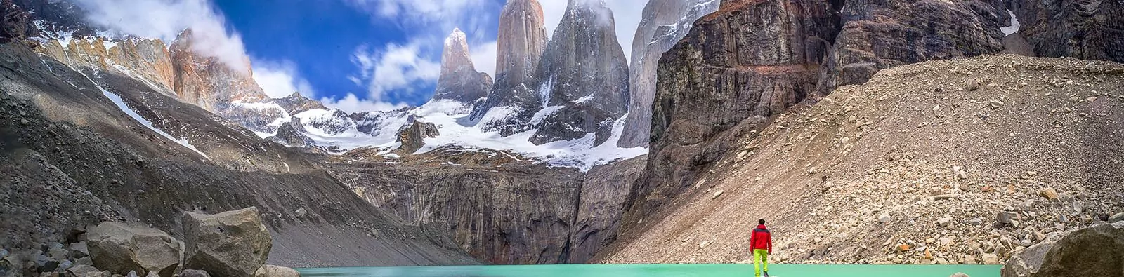 Hiker at Base de las Torres viewpoint in Torres del Paine, Patagonia