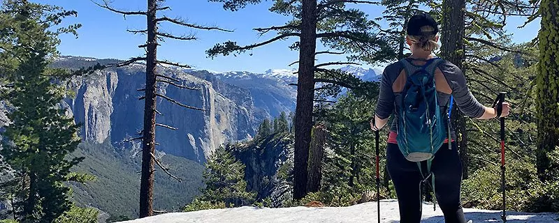 female hiker looking at mountain vista